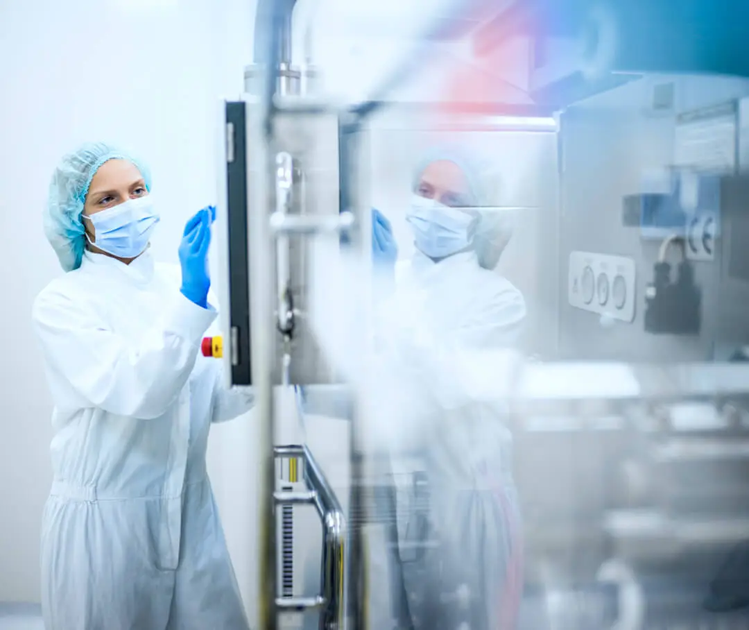 A technician operates some machinery.