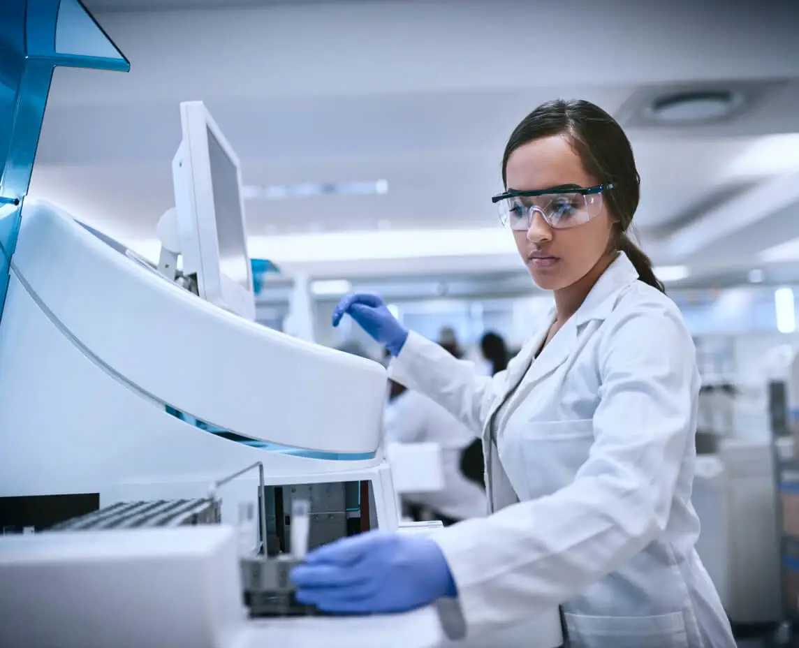 A technician processes a vial