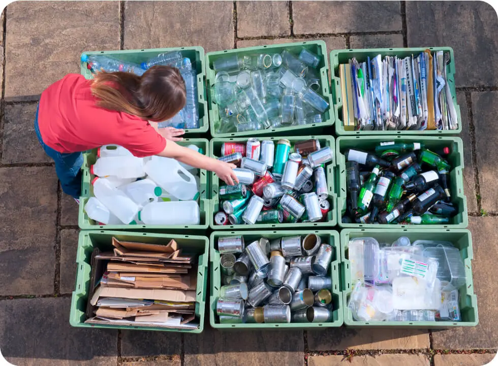 An aeriel view of a person sorting recyclables.