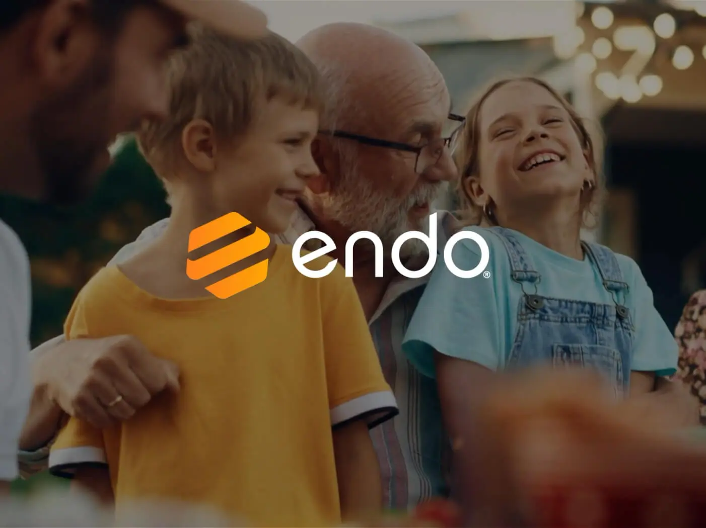 A happy family and the Endo logo