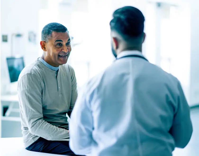 A patient in the middle of a discussion with their doctor