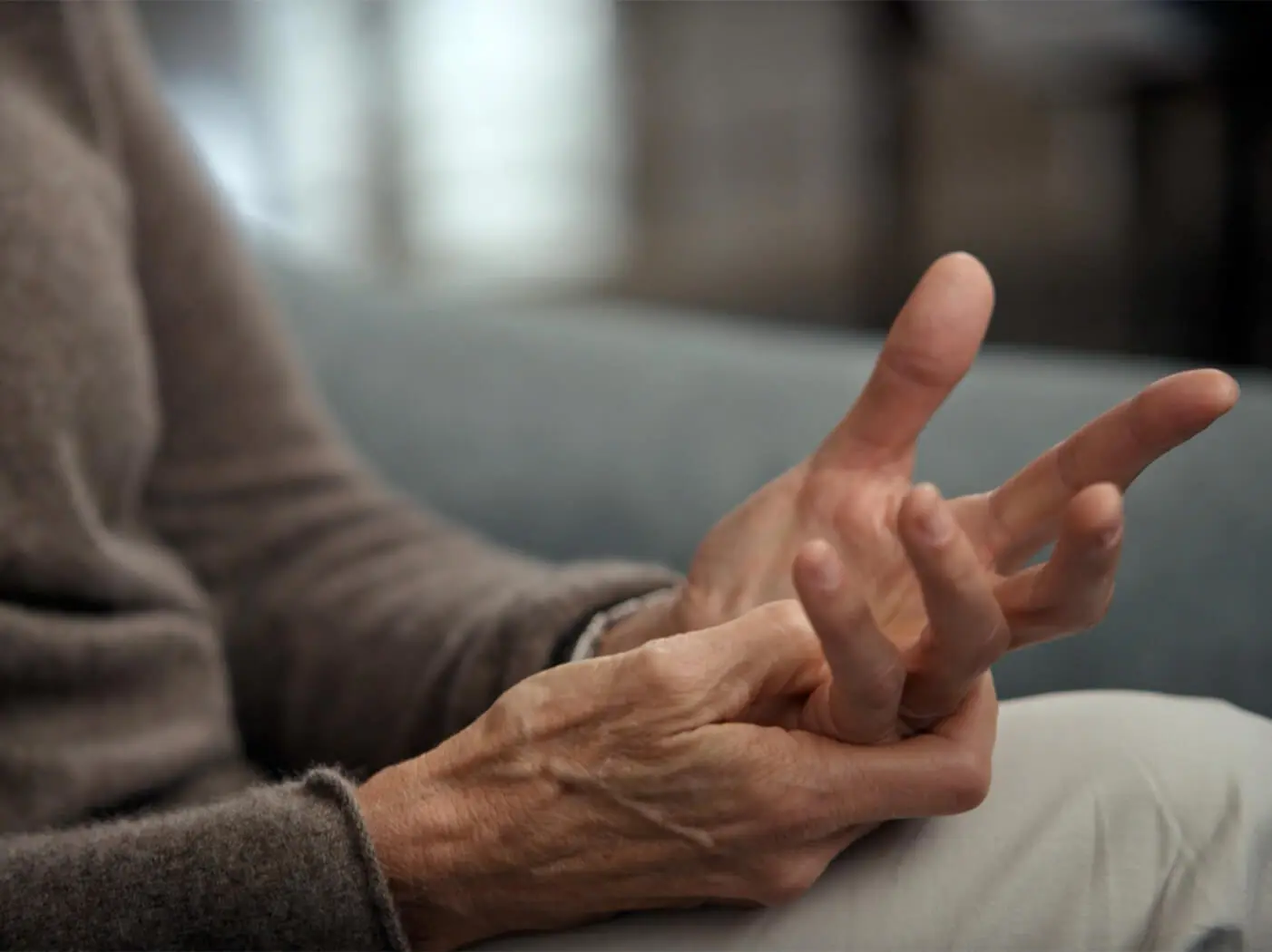 A close up of the hands of a Dupuytren's contracture patient